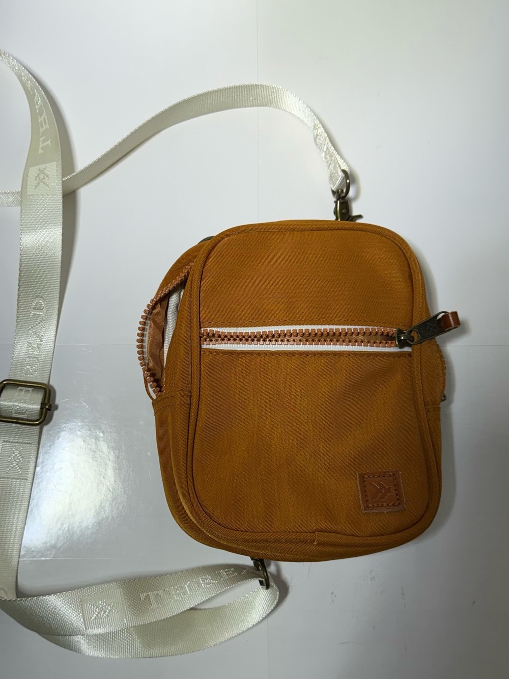 Compact Tan zippered multi pocket Crossbody Bag by Threads in Honey